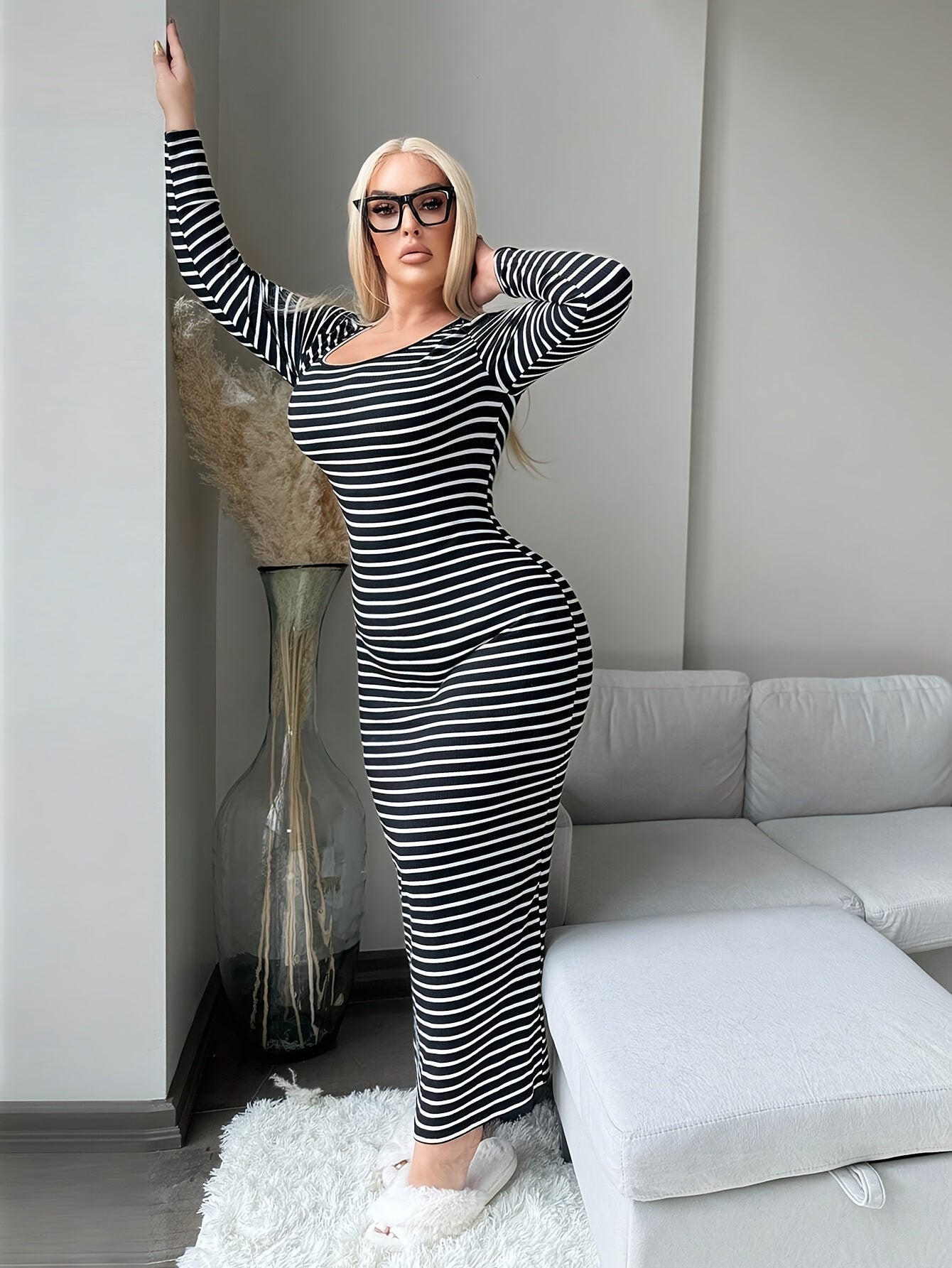 Plus size woman in a full dress black and white striped