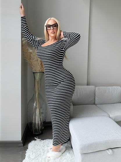 Plus size woman in a full dress black and white striped